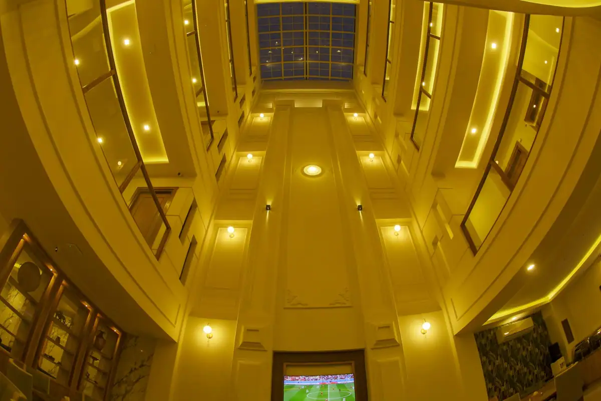 Golden-lit atrium above the restaurant